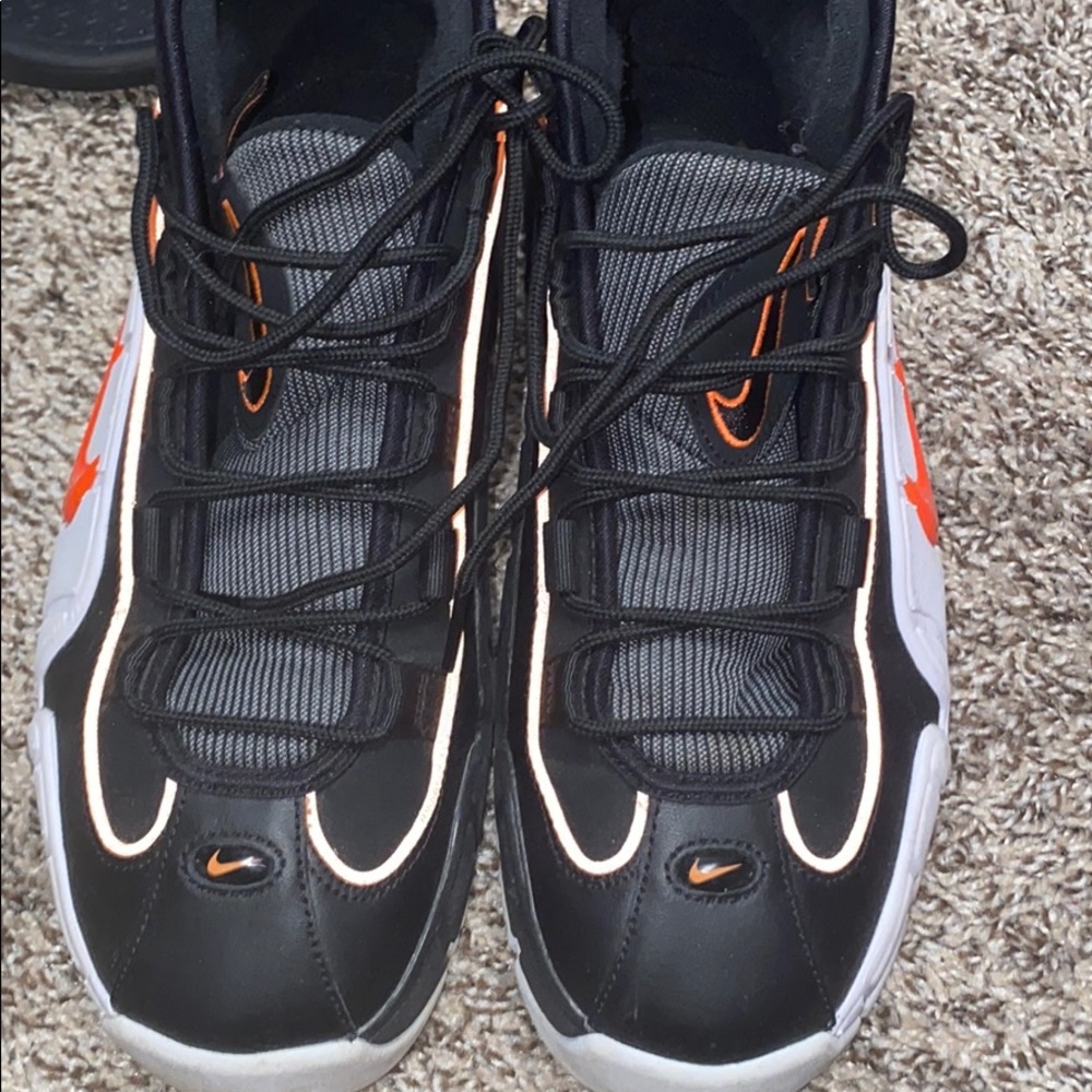 Black orange and white Nike's